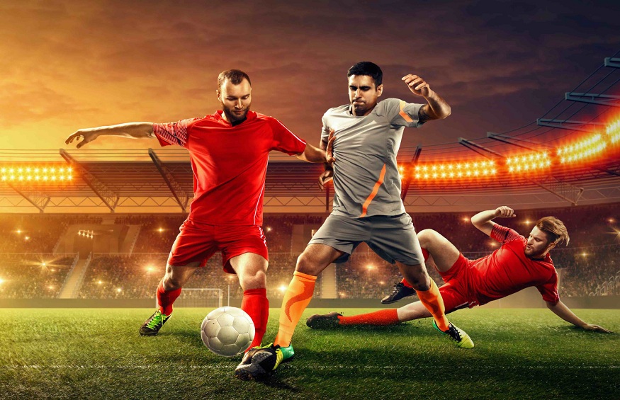 Soccer players fight for a ball. Professional soccer stadium. Sport event